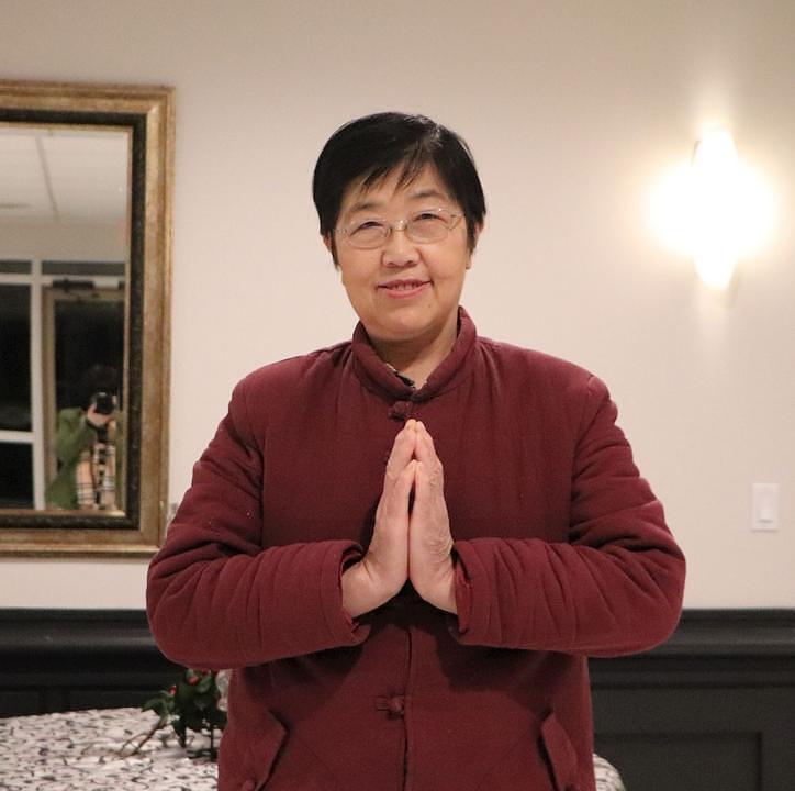 Gospođa Wu Yanxia je za Falun Dafa čula od svog supruga.