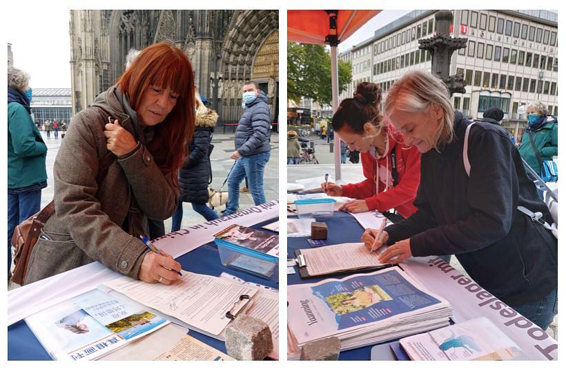 Ljudi potpisuju peticiju kojom osuđuju progon Falun Dafa od strane KPK.
